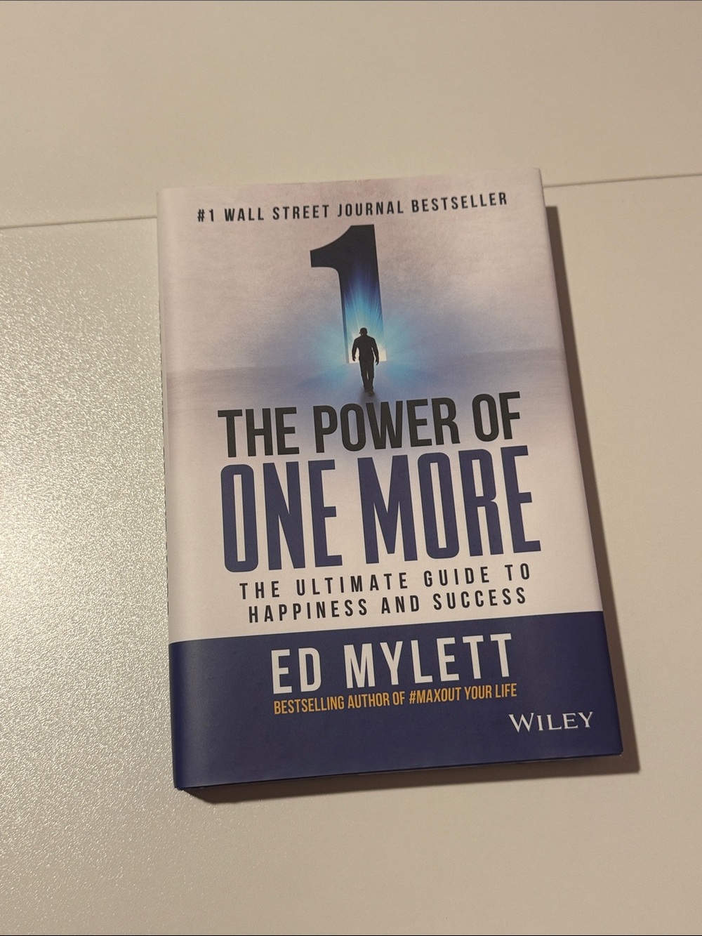 The Power of One More by Ed Mylett - White & Blue Hardcover